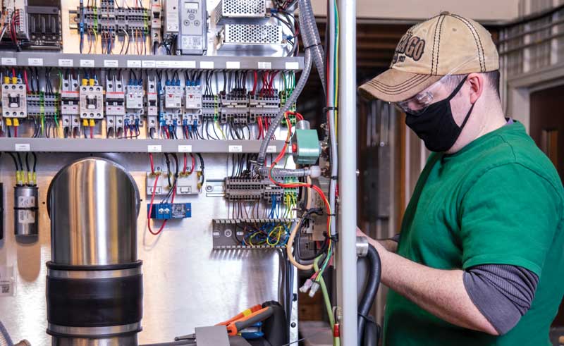 Brian checks the electrical system on a laboratory freeze dryer