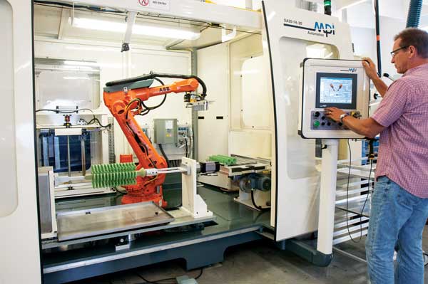 MPI, Inc. machine operator programming the APAS (Automated Pattern Assembly System).