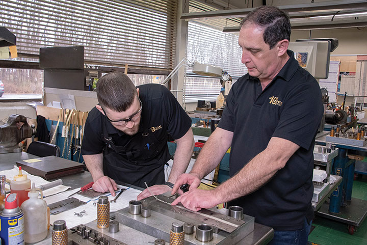 With his mentor Frank semi-retired and living in North Carolina, Rob often consults with Senior Toolmaker, Mario Rojo.