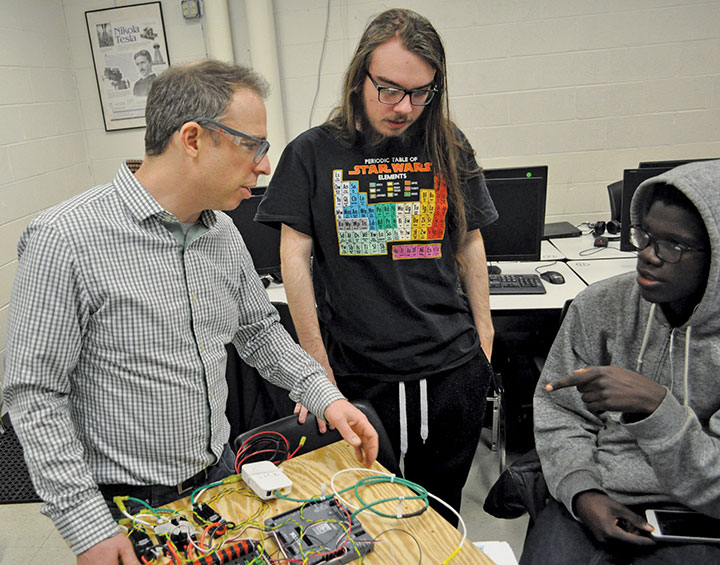 Teacher and students in robotics Star Wars challenge