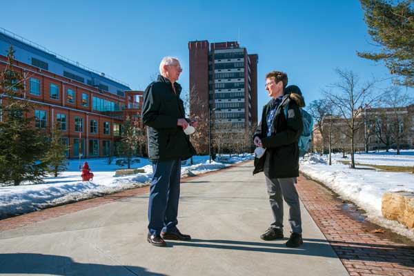 Don Christian on Campus with a Student