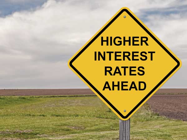 road sign reading: higher interest rates ahead